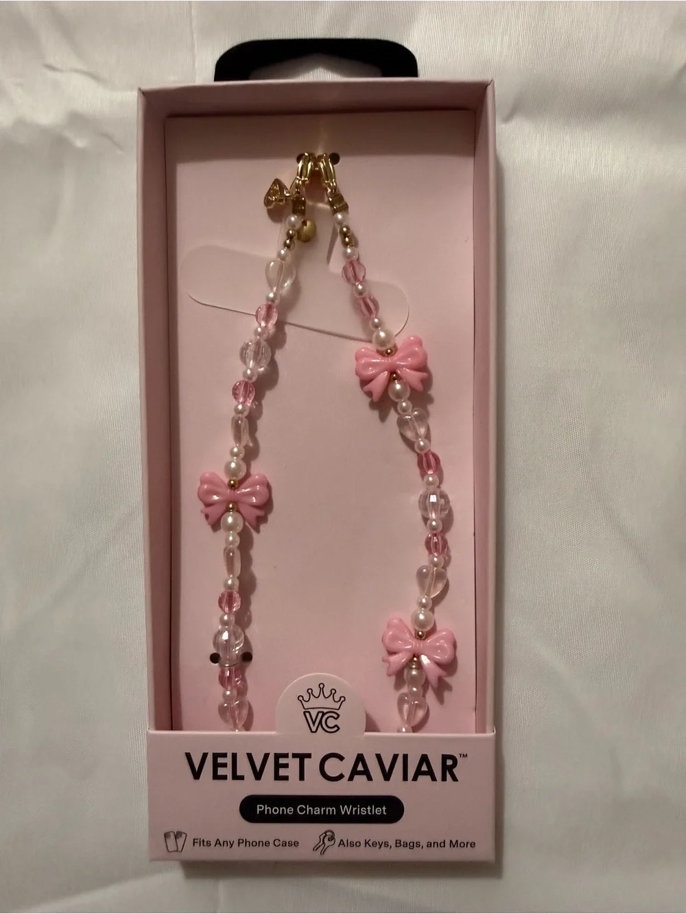 Velvet Caviar Pink and White Beaded Phone Strap with Bow Accents